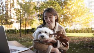 medium-shot-smiley-woman-holding-dog